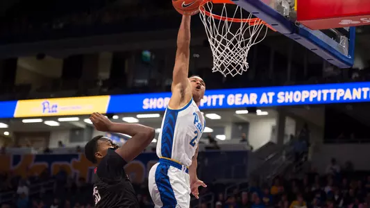 Trey McGowens dunking against Nicholls State.