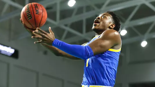 Xavier Johnson attempting a layup.