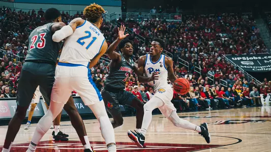 Xavier Johnson driving the lane against Louisville.