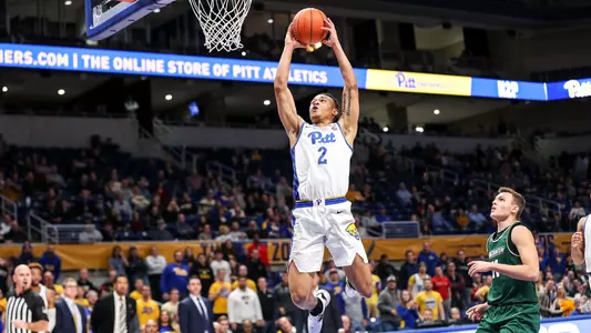 Trey McGowens dunking against Binghamton.