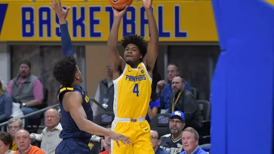 Gerald Drumgoole, Jr. shooting over a West Virginia defender.