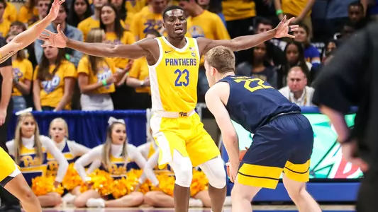 Samson George defending against West Virginia.