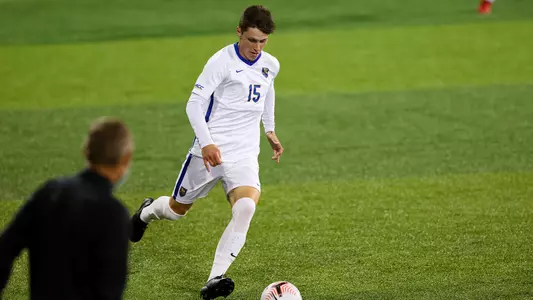 Luke Mort dribbling against Louisville
