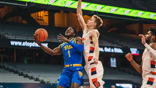 Xavier Johnson shooting a layup at Syracuse.