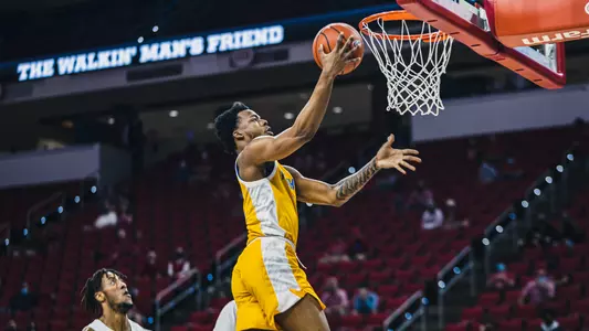 Femi Odukale converting a layup at NC State.