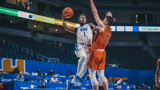 Xavier Johnson attempting a layup against Virginia Tech.