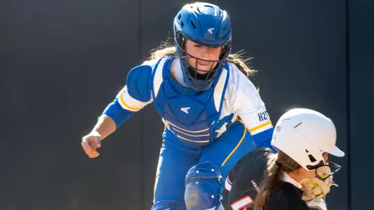 Jack Busch tagging a runner out at Virginia Tech.