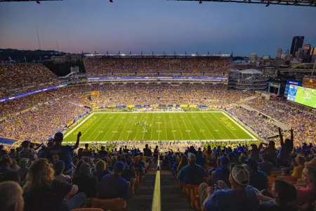 A wide shot of Acrisure Stadium from the stands during the Backyard Brawl at twilight