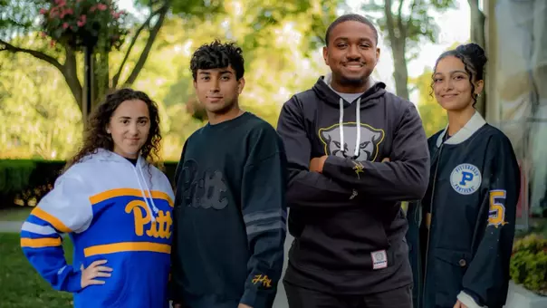 Models wearing the Fall 2024 Mitchell & Ness x Louis Riddick collection now.