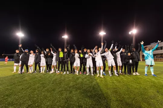 The Pitt Men's Soccer team celebrating after a win