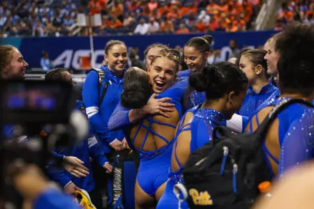 Hallie Copperwheat hugging Jordyn Ewing at ACC Gymnastics Championships