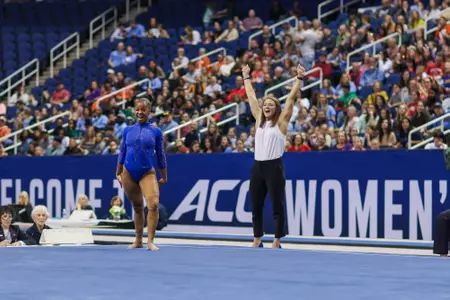 Jordyn Ewing competing on floor event at ACC Championships in blue leotard
