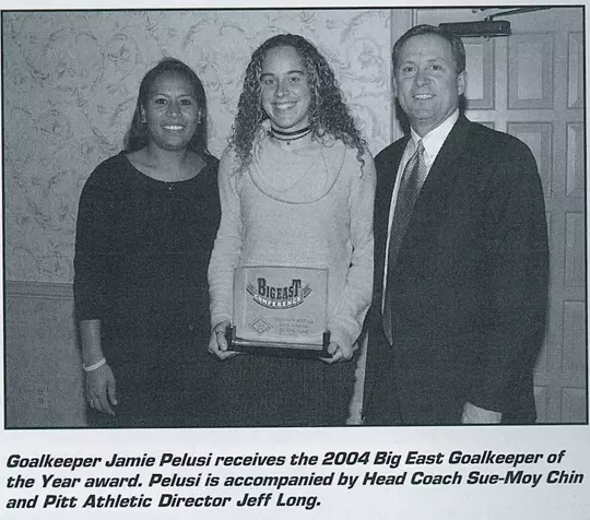 Goalkeeper Jamie Pelusi receives the 2004 Big East Goalkeeper of the Year award. Pelusi is accompanied by Head Coach Sue-Moy Chin and Pitt Athletic Director Jeff Long.