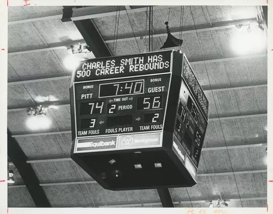 The scoreboard at the Fitzgerald Fieldhouse that reads "CHARLES SMITH HAS 500 CAREER REBOUNDS"