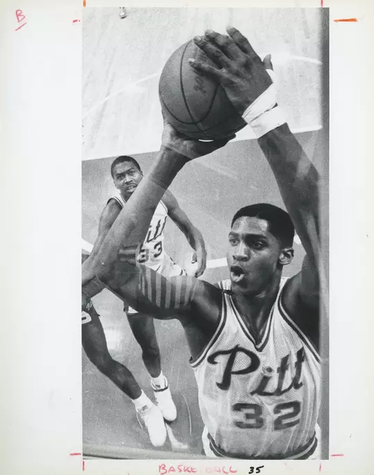 CHARLES SMITH close up as he goes to dunk a ball
