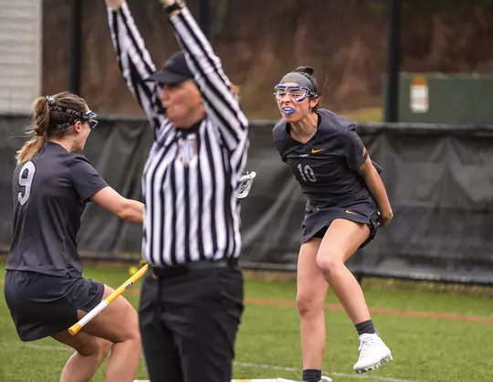 Lacrosse defender Rachel Familetti, #10, celebrates after scoring her first and only goal of the season.