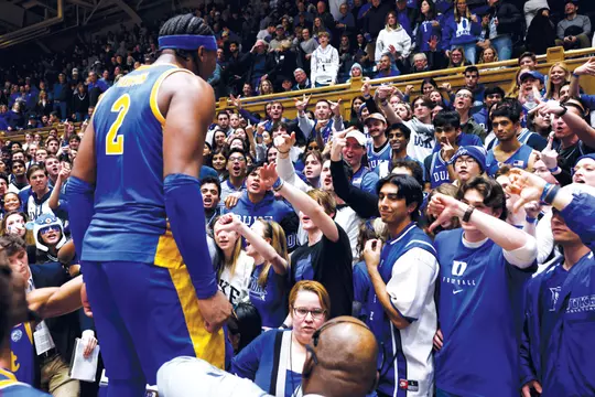 DURHAM, NORTH CAROLINA - JANUARY 20: The Cameron Crazies react as Blake Hinson #2 of the Pittsburgh Panthers celebrates following their 80-76 win against the Duke Blue Devils at Cameron Indoor Stadium on January 20, 2024 in Durham, North Carolina. (Photo by Lance King/Getty Images)