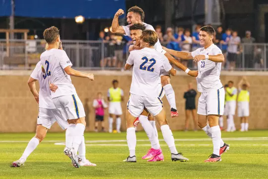 The Men’s Soccer team celebrates a first half goal by Eben McIntyre off an assist from Filip Mirkovic during a dominant 3-0 victory over No. 9 Wake Forest at Ambrose Urbanic Field.