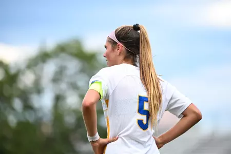 Sarah Schupansky pictured with back turned showing number five on her white jersey.