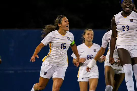 A Pitt women's soccer player celebrates after a goal