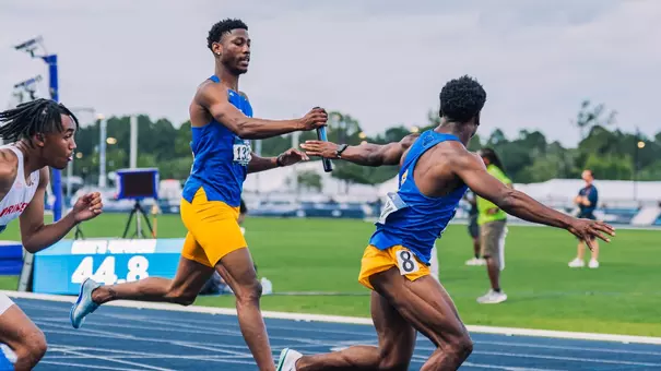 Malik Nigel running a relay