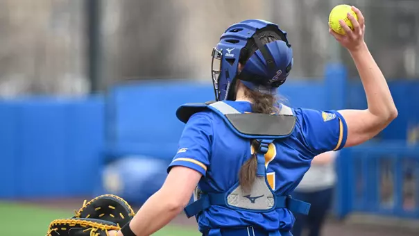 Action Shot of Softball Catcher