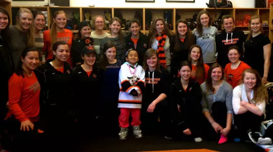 Women's Hockey Adopts Nyla as Part of Team Impact