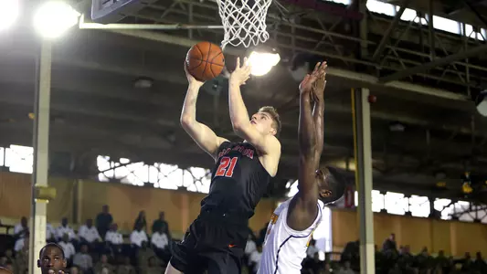 Henry Caruso goes to the basket.