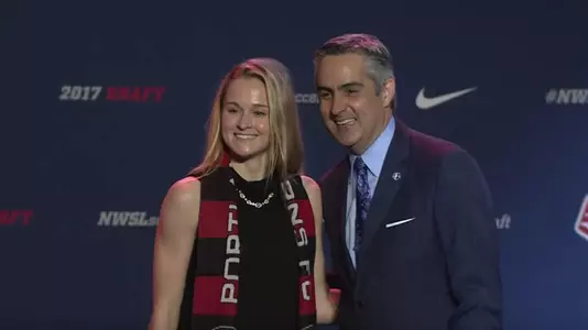 Tyler Lussi with NWSL commissioner Jeff Plush after Lussi's selection by the Portland Thorns.