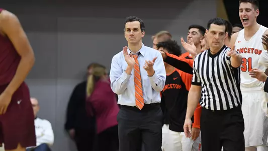 Mitch Henderson applauds.