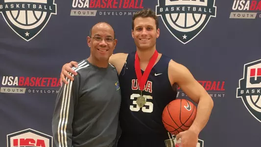 Dan Mavraides '11 with team sponsor John Rogers '80.