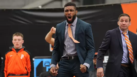 Princeton assistant coach Nate Jackson reacts at a wrestling meet.