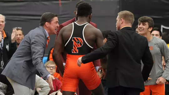 Quincy Monday and coaches vs. Iowa