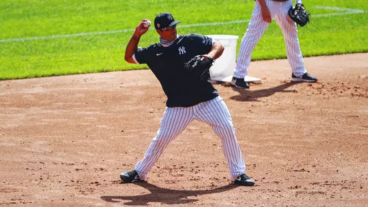 Mike Ford of the New York Yankees throws a ball during infield practice.