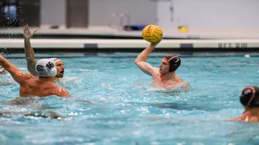 Keller Maloney prepares to make a pass with the defense crowding him