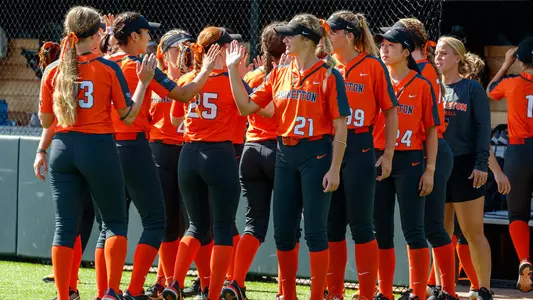 softball team hi-five huddle