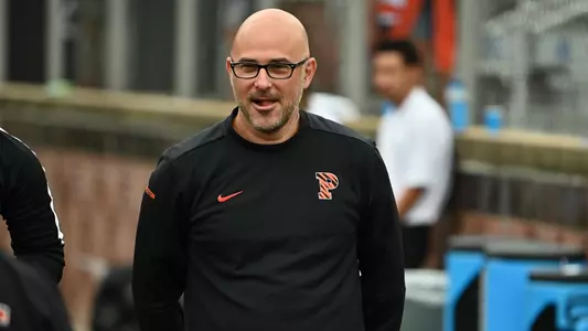 Mike Poller coaching action