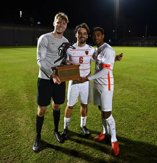 men's soccer captains with trophy