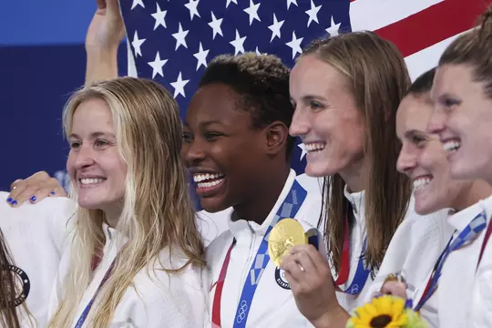 TOKYO, JAPAN - AUGUST 07: From left, Gold medalists Stephanie Haralabidis, Ashleigh Johnson and Makenzie Fischer of Team United States pose after the Women's Gold Medal match between Spain and the United States on day fifteen of the Tokyo 2020 Olympic Games at Tatsumi Water Polo Centre on August 07, 2021 in Tokyo, Japan. (Photo by Tom Pennington/Getty Images)