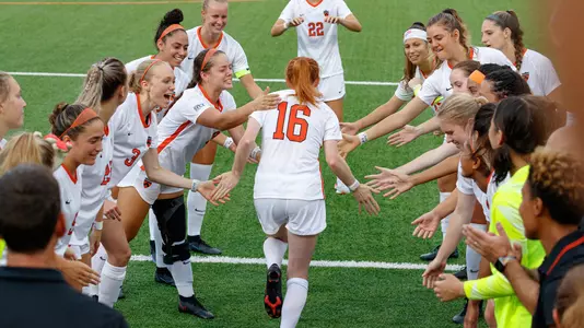 Jen Estes greets teammates as she is introduced