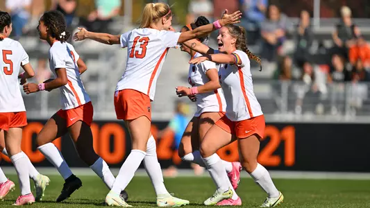 Lexi Hiltunen and Kamryn Loustau celebrate a goal