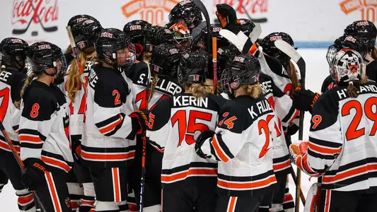 women's hockey huddle/celebration photo