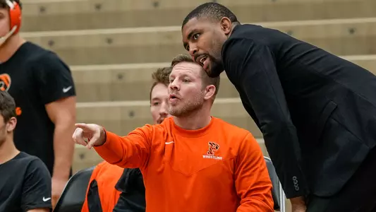 Joe Dubuque and Nate Jackson coaching action