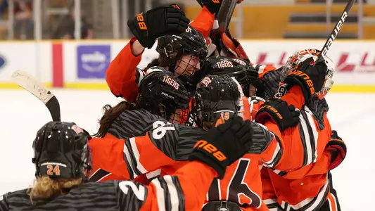 Issy Wunder and the Tigers celebrate the shootout-clinching goal against Cornell