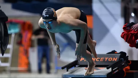 Men's Swimmer Diving Off Blocks