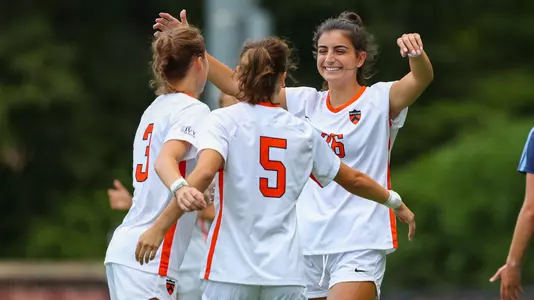 Ella Midura, Drew Coomans, Ally Murphy celebration photo