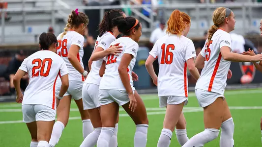 princeton women's soccer players on the field after a goal
