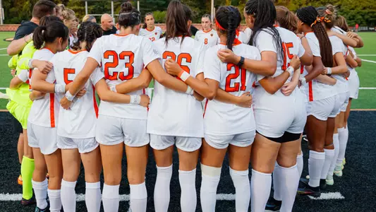 women's soccer team huddle