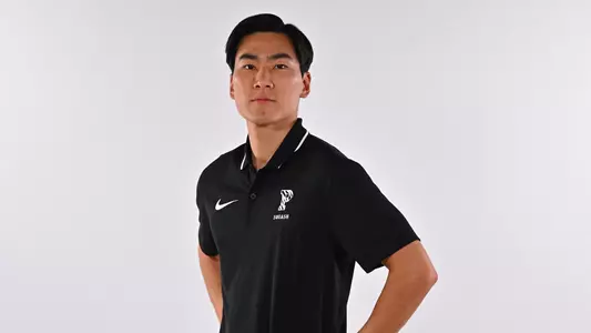 Alastair cho posed photo