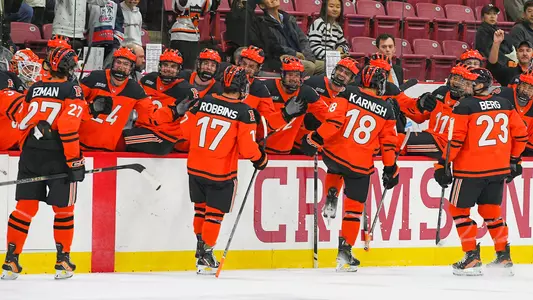 Men's Hockey celebrates goal at Harvard in 2023